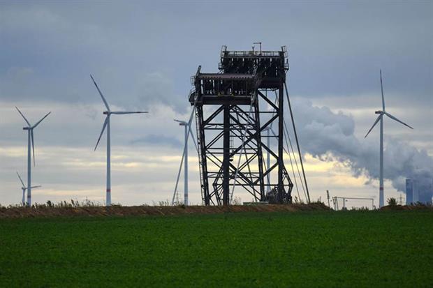 A coal excavator and wind turbines are seen near Juechen, western Germany, September 2020. Renewables are rapidly replacing coal power in Europe’s grids. Photo: Ina Fassbender/AFP via Getty Images