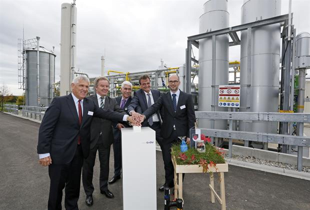 Dignitaries including environment minister Franz Saucer (second left) start the facility