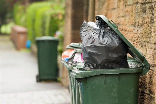 Wheelie bin with household waste awaiting collection