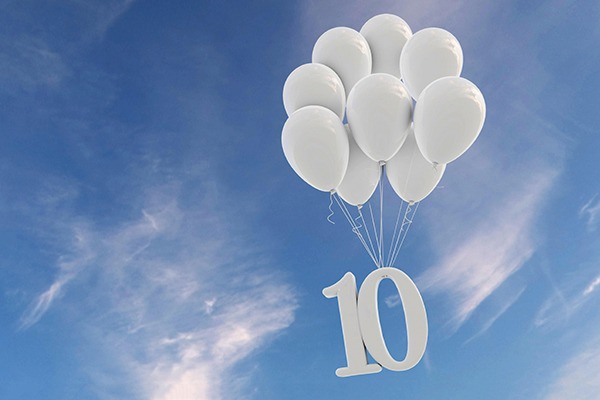 Balloons carrying number 10 sign