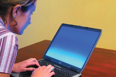 Woman on laptop, courtesy of Matthew Bowden, Wikimedia