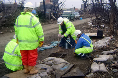 Environment Agency officers investigate the Buncefield disaster