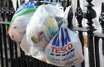 Plastic carrier bags being reused to for waste (Credit: Betty Finney/Alamy)