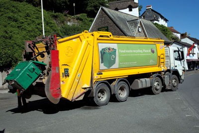 A council truck disposes of food waste collected from households in Lynmouth, Devon (photo: Mark Boulton/Alamy)