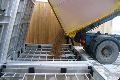 Woodchips being poured into a biomass storage tank. The EU believes DECC is offering large biomass projects too much support (Photo: Econery)