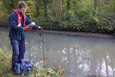 An Environment Agency officer monitors oxygen levels in the river Crane (credit: Environment Agency)