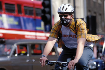 London cyclist with breathing mask (Melanie Friend/Alamy)