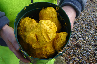 Yellow waxy material was washed ashore on beaches in East and West Wittering (photo: Environment Agency)