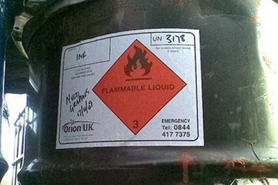 Hazardous liquid stored in drums at industrial units in Skelmersdale, Lancashire, leaked into the River Tawd (photograph: Environment Agency)