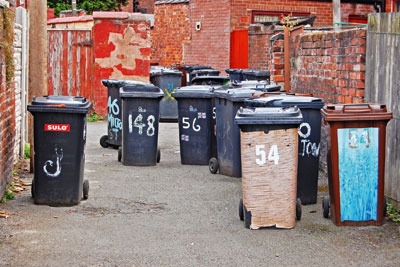 Wheelie bins in a backstreet. Credit: Ian Sidlow/Dreamstime.com