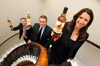 Lightweight whiskey bottle launched by Marissa Lippiatt, chief executive of Resource Efficient Scotland, with Glen Gribbon, director of The Famous Grouse (middle) and Scottish environment secretary Richard Lochead