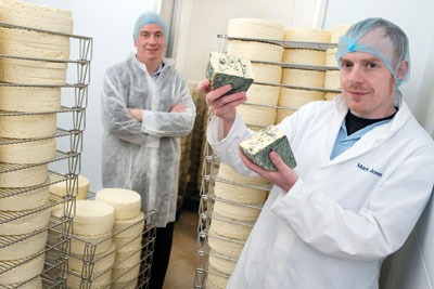 Huw Lloyd, Business Account Manager at WRAP (left) with Mark Jones of the Carmarthenshire Cheese Company (right) (photograph: Welsh government)