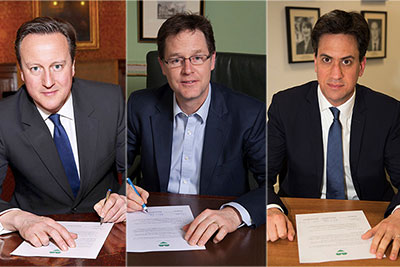 David Cameron, Nick Clegg and Ed Miliband have all signed the cross-party agreement (photograph: Green Alliance)