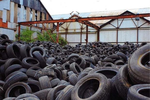 Thousands of waste tyres illegally dumped in a large yard (photograph: Natural Resources Wales)