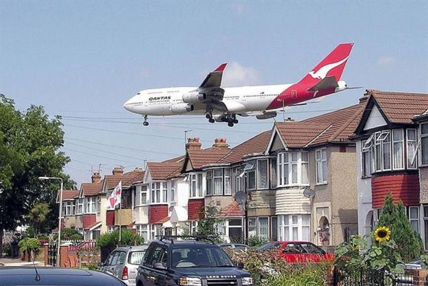 Aircraft using Heathrow Airport pass very close to housing. Photograph: Adrian Pingstone