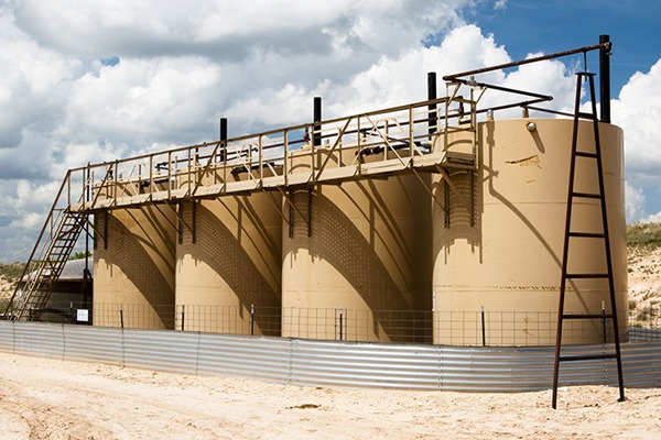 Storage tanks on an oil and gas production site. Photograph: Jim Parkin/123RF