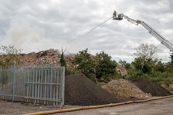The local Fire Service used nearby ponds and a crane to fight the 2-month blaze. Photograph: Essex County Fire & Rescue Service