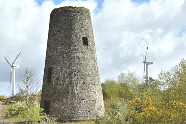 The site of this derelict industrial wind mill in Newtonards has been taken over by two wind turbines. Photograph: Albert Bridge (CC BY_SA 2.0)