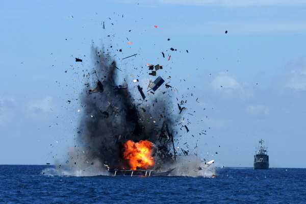 The Indonesian Navy blowing up a foreign vessel caught fishing illegally. Photograph: EPA/IMANK