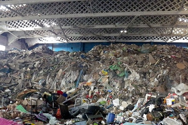 The waste, which included plastic, plasterboard, wood, carpet and rubble, posed a significant fire risk. Photograph: Natural Resources Wales