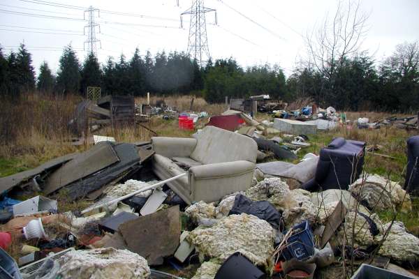Fly-tipped waste on a field