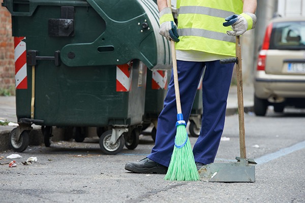 Clearing litter. Photograph: Dmitry Kalinovsky/123RF