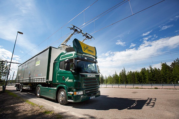 Promising technology or “slightly bonkers”? Siemens and Scania’s hybrid lorry uses power from electric cables strung over a 2km stretch of Swedish motorway. Photograph: Scania