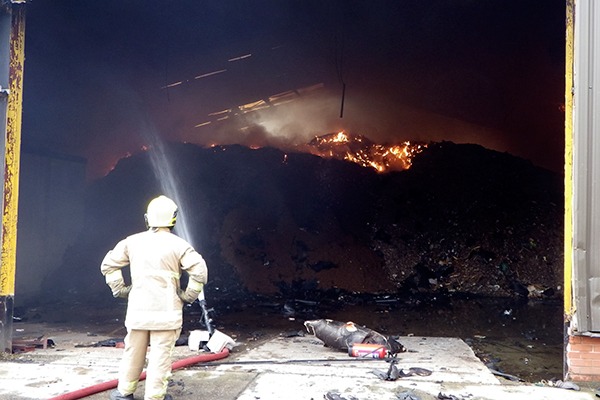 The material brought onto the site caught fire at least twice in the summer of 2014. Photograph: Natural Resources Wales
