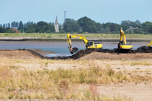 Sea wall breached to allow tidal flooding