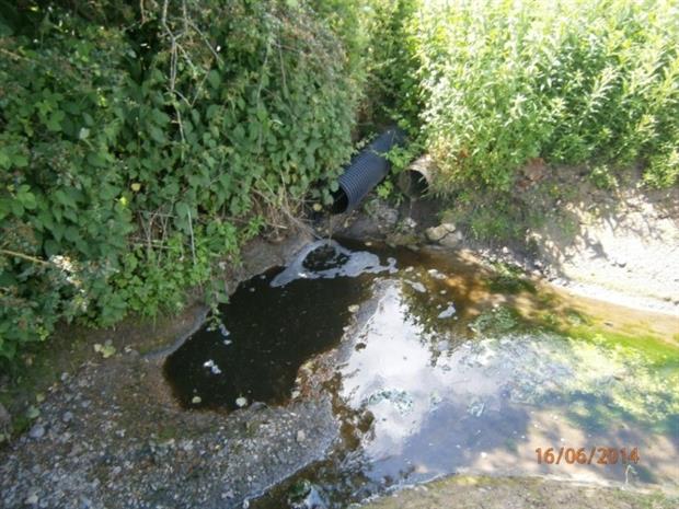 Silage from an outfall at New Heaton Farm polluting a watercourse
