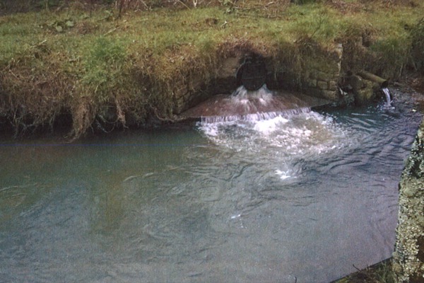 Sewage was illegally discharged from an outfall at Calenick sewage pumping station into Calenick creek. Photo: Environment Agency