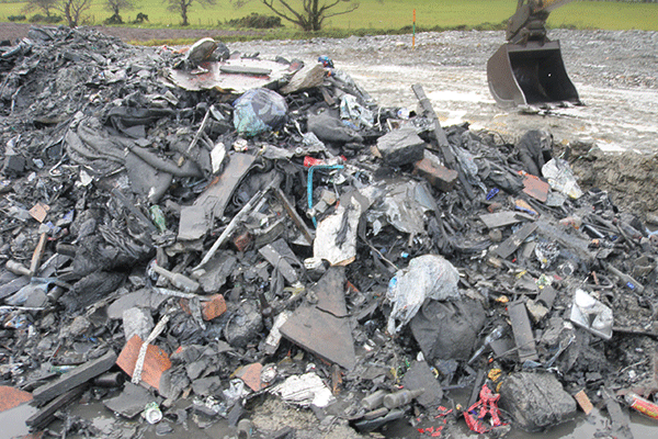 About 52,000 tonnes of mixed waste, including PVC window frames, wood and concrete blocks, were buried illegally at the Londonderry site. Photograph: Northern Ireland Environment Agency