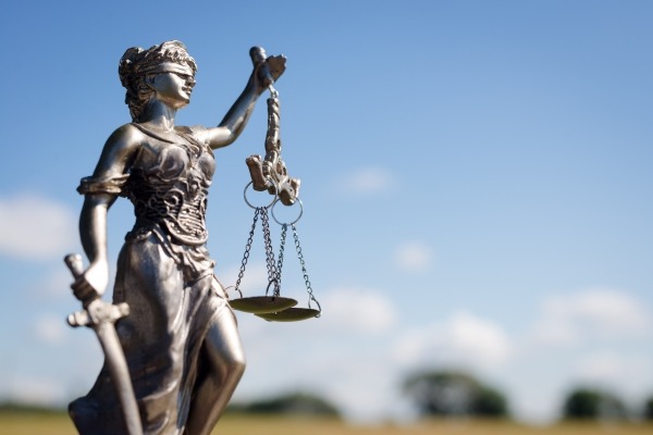 Justice may be blind, but it does not come for free.