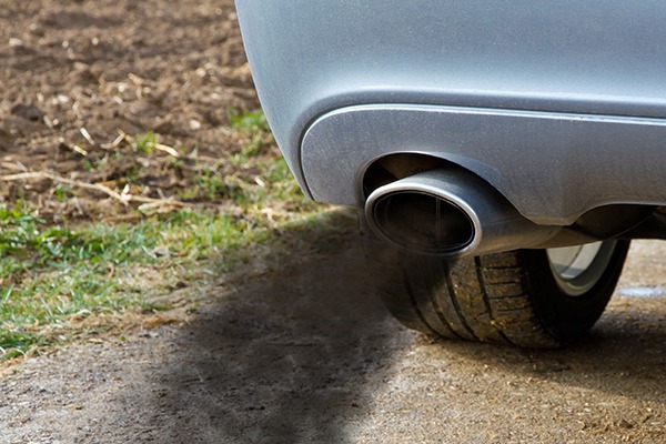 car belching diesel smoke and particulates