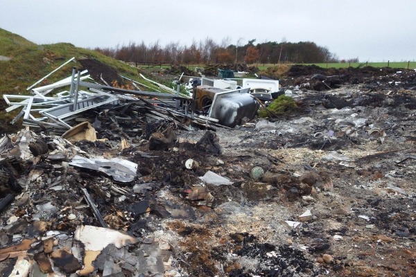 Pickering burnt waste including uPVC doors, window frames, wood and wheelie bins. Photograph: Environment Agency