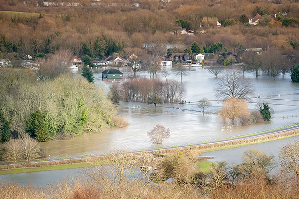 Flooded farmland and houses. Photograph: Steve Mann/123RF