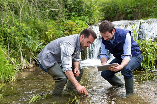 Men taking water samples from river. Photograph: Prig Morisse/123RF