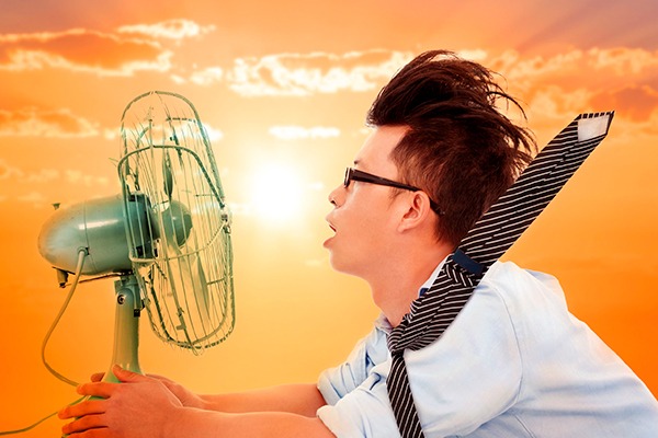 Man in front of fan. Photograph: Wang Tom/123RF