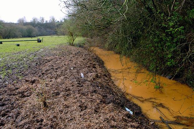 Polluted stream on top of an old landfill site. Photograph: Jeff Morgan/Alamy Stock Photo