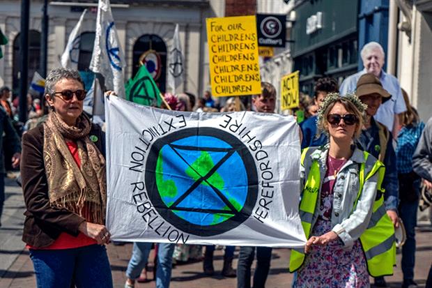 Extinction Rebellion protestors marching through the city of Hereford in May. Photograph: Jim Wood/Barcroft Media via Getty Images
