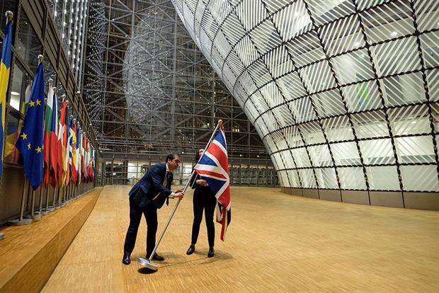 Brexit: Officials take down the UK flag from the European Council building in Brussels. Photograph: Thierry Monasse/Getty Images