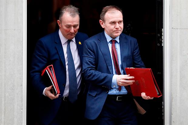 Newly appointed environment secretary George Eustice (right) leaves Downing Street after the first cabinet meeting since yesterday's reshuffle. Photograph: Tolga Akmen/Getty Images