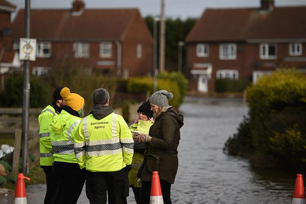Environment Agency officers will now be respecting social distancing rules. Photograph: Oli Scarff/Getty Images