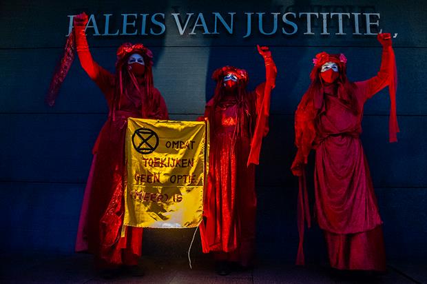 Protestors outside the Dutch Court. Photograph: NurPhoto/Getty Images