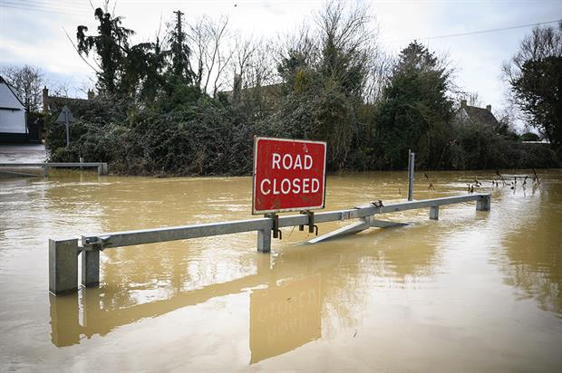 Flooding and heatwaves are just some of the climate change impacts already being experience by the UK. Photograph: Leon Neal/Getty Images