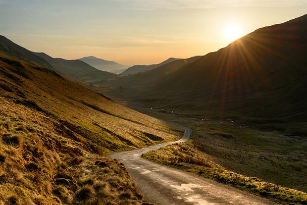 Road winding through hills in the Lake District