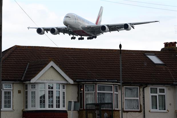 A plane flies over Myrtle Avenue, Hounslow: noise pollution is one of the big hurdles faced by Heathrow airport's expansion plans (James D. Morgan/Getty).