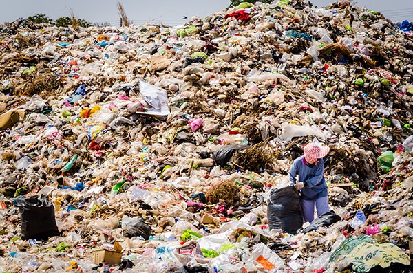 People working in landfill in Thailand