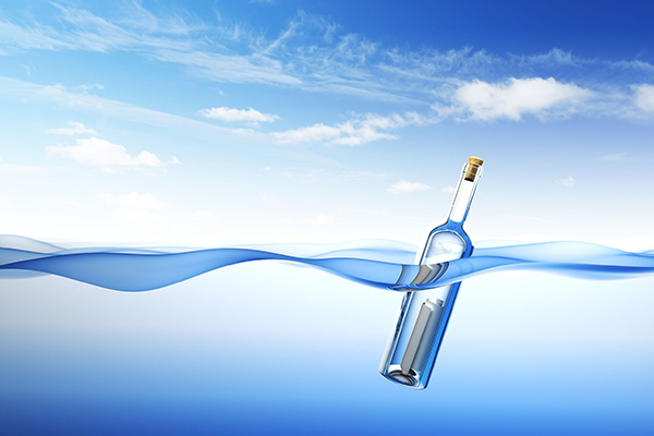 Illustration of a message in a bottle in bobbing in the water