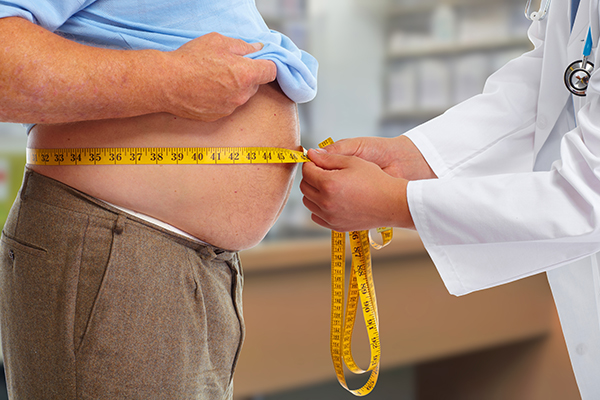 Man having his waist measured